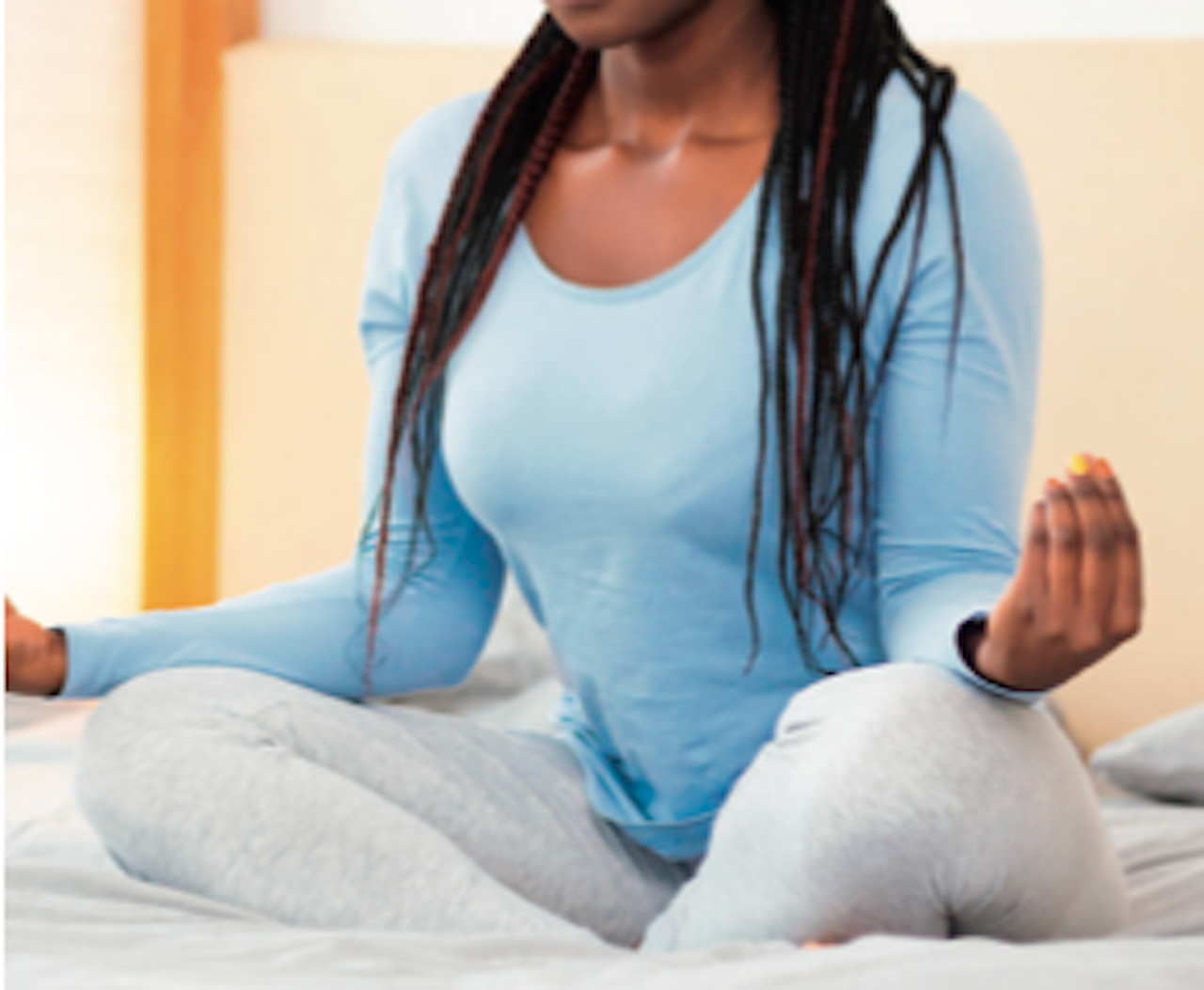 image of woman of color meditating Breanne Goldman yoga and wellness denver